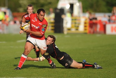 10.05.08 - Magners League Rugby Llanelli Scarlets v Edinburgh Scarlets' Deacon Manu is brought down 