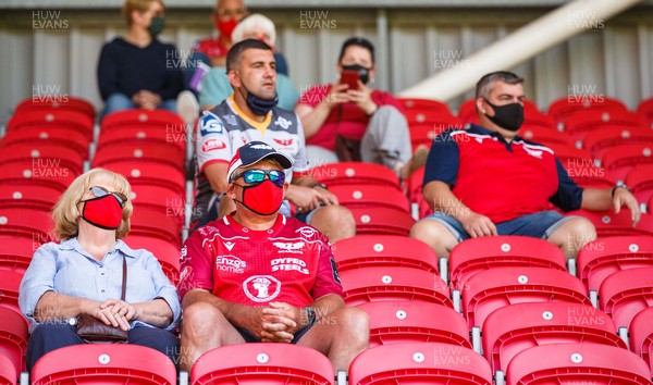 130621 - Scarlets v Edinburgh - Guinness PRO14 Rainbow Cup - Scarlets supporters sit in the stands ahead of kick off