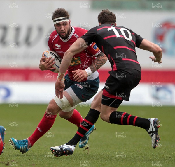 220214 - Scarlets v Edinburgh - RABODirect Pro 12 - Josh Turnbull of Scarlets is tackled by Carl Bezuidenhout of Edinburgh 