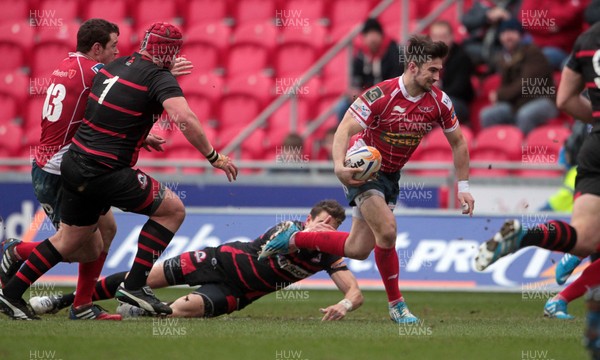 220214 - Scarlets v Edinburgh - RABODirect Pro 12 - Kristian Phillips of Scarlets gets past the Edinburgh defence to score their second try 