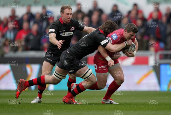 280315 - Scarlets v Edinburgh - Guinness PRO12 - Scott Williams of Scarlets is tackled by Ben Toolis of Edinburgh