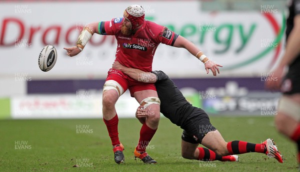 280315 - Scarlets v Edinburgh - Guinness PRO12 - Jake Ball of Scarlets is tackled by Andries Strauss of Edinburgh