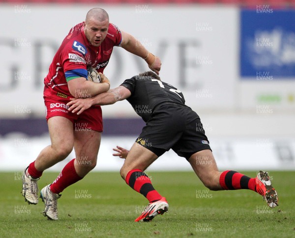 280315 - Scarlets v Edinburgh - Guinness PRO12 - Rob Davies of Scarlets is tackled by Andries Strauss of Edinburgh