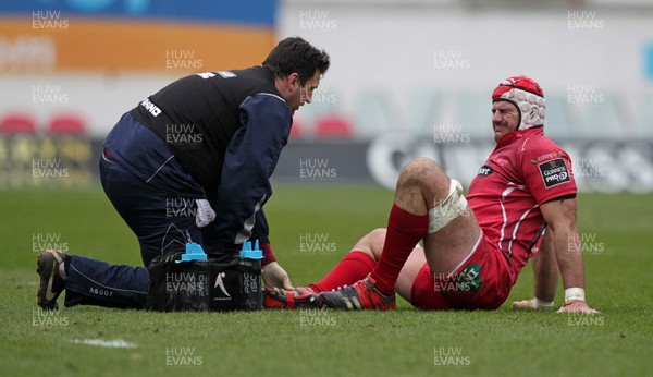 280315 - Scarlets v Edinburgh - Guinness PRO12 - George Earle of Scarlets is looked at by medics