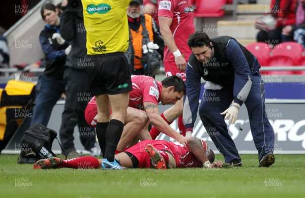 280315 - Scarlets v Edinburgh - Guinness PRO12 - Michael Tagicakibau of Scarlets goes down injured