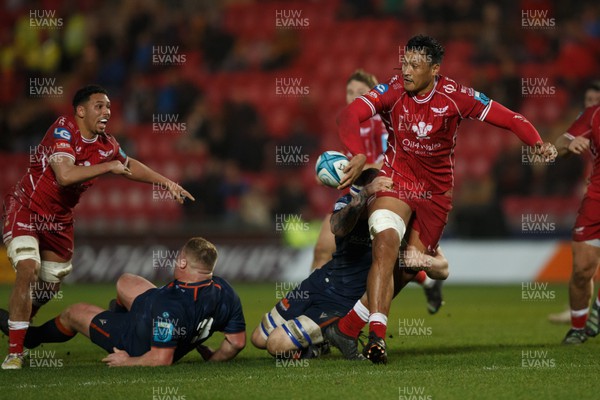 180223 - Scarlets v Edinburgh Rugby - United Rugby Championship - Sam Lousi of Scarlets offloads the ball  in the build-up to Steff Evans' try
