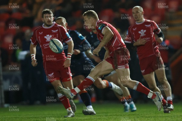 180223 - Scarlets v Edinburgh Rugby - United Rugby Championship - Johnny McNicholl of Scarlets chips the ball