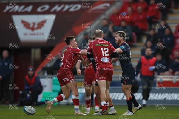 180223 - Scarlets v Edinburgh Rugby - United Rugby Championship - Joe Roberts of Scarlets (L) and Mark Bennett of Edinburgh (R) have a disagreement as Ioan Nicholas of Scarlets (12) tries to keep them apart