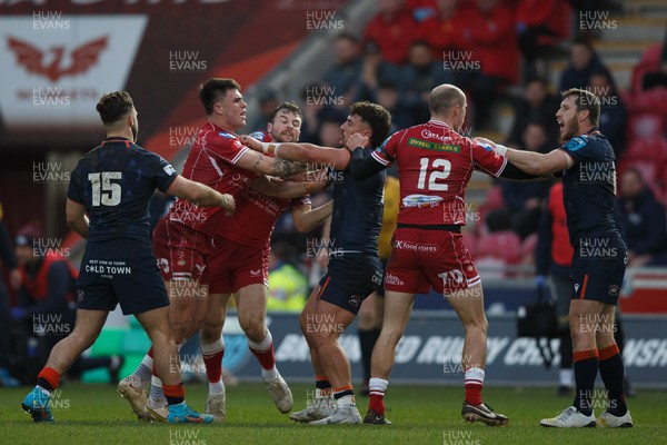 180223 - Scarlets v Edinburgh Rugby - United Rugby Championship - Joe Roberts of Scarlets and Damien Hoyland of Edinburgh square up to each other as Ioan Nicholas of Scarlets and Mark Bennett of Edinburgh also have a disagreement