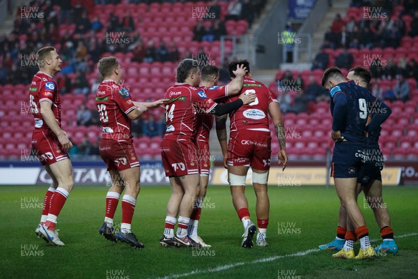 180223 - Scarlets v Edinburgh Rugby - United Rugby Championship - Scarlets players congratulate Vaea Fifita of Scarlets after scoring a try