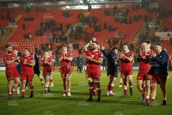 180223 - Scarlets v Edinburgh Rugby - United Rugby Championship - Scarlets players celebrate with the crowd after the match