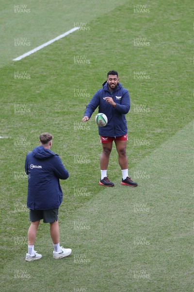 180223 - Scarlets v Edinburgh Rugby - United Rugby Championship - Ben Williams and Carwyn Tuipulotu of Scarlets warm up before kick off