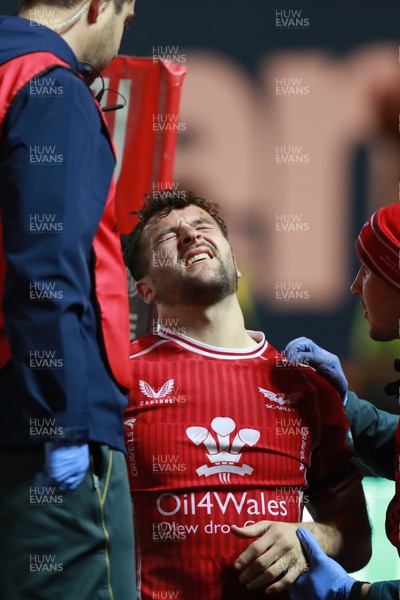 180223 - Scarlets v Edinburgh Rugby - Ryan Conbeer of Scarlets receives treatment for injury after scoring a try