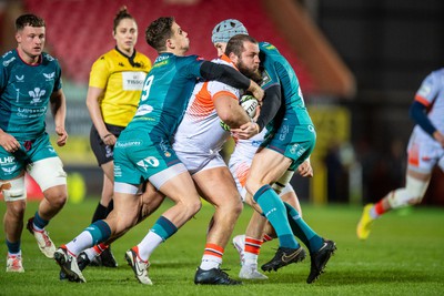 190124 - Scarlets v Edinburgh Rugby - EPCR Challenge Cup - Pierre Schoeman of Edinburgh is tackled by Kieran Hardy of Scarlets and Jonathan Davies of Scarlets