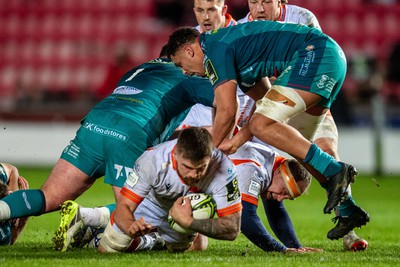 190124 - Scarlets v Edinburgh Rugby - EPCR Challenge Cup - Luke Crosbie of Edinburgh is tackled by Steff Thomas of Scarlets and Dan Davis of Scarlets