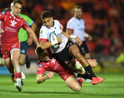 011021 - Scarlets v Emirates Lions - United Rugby Championship - Jordan Hendrikse of Lions is tackled by Sam Costelow of Scarlets