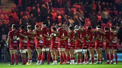 011021 - Scarlets v Emirates Lions - United Rugby Championship - Scarlets players during a minutes silence