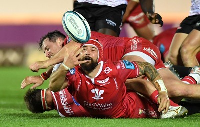 011021 - Scarlets v Emirates Lions - United Rugby Championship - Blade Thomson of Scarlets tries to gather the ball