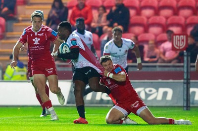 011021 - Scarlets v Emirates Lions - United Rugby Championship - Steff Evans of Scarlets tackles Wandisile Simelane of Emirates Lions