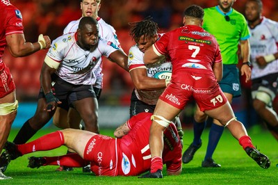 011021 - Scarlets v Emirates Lions - United Rugby Championship - Vincent Tshituka of Emirates Lions is tackled by Dan Davis of Scarlets