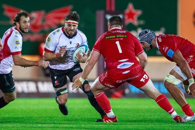 011021 - Scarlets v Emirates Lions - United Rugby Championship - Jaco Kriel of Emirates Lions runs at Rob Evans of Scarlets