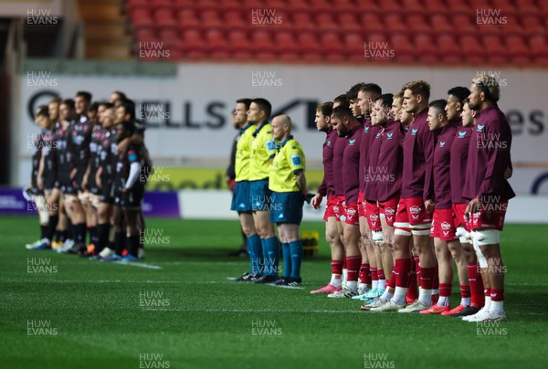111123 - Scarlets v Emirates Lions, United Rugby Championship - The teams line up to observe a minutes silence to mark Remembrance Day