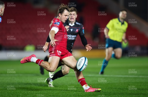 111123 - Scarlets v Emirates Lions, United Rugby Championship - Ioan Lloyd of Scarlets kicks ahead
