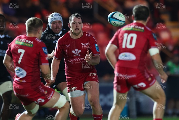 111123 - Scarlets v Emirates Lions, United Rugby Championship - Ryan Elias of Scarlets passes the ball to Ioan Lloyd of Scarlets