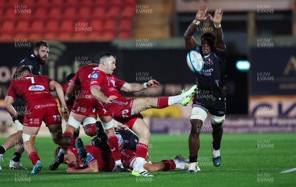 111123 - Scarlets v Emirates Lions, United Rugby Championship - Emmanuel Tshituka of Lions attempts to charge down the kick from Gareth Davies of Scarlets