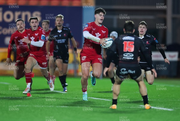 111123 - Scarlets v Emirates Lions, United Rugby Championship - Eddie James of Scarlets looks to pass as he takes on Quan Horn of Lions