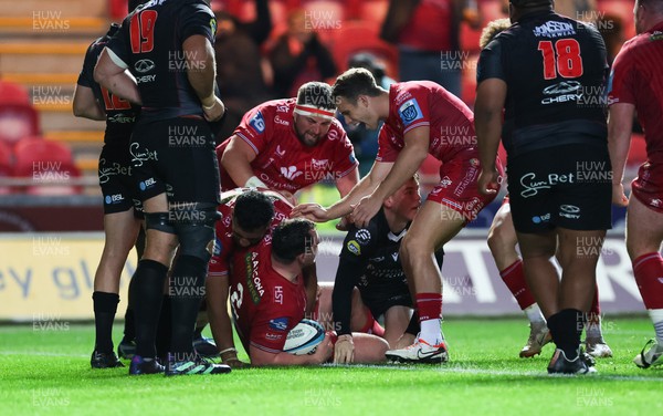 111123 - Scarlets v Emirates Lions, United Rugby Championship - Ryan Elias of Scarlets is congratulated after powers over to score try