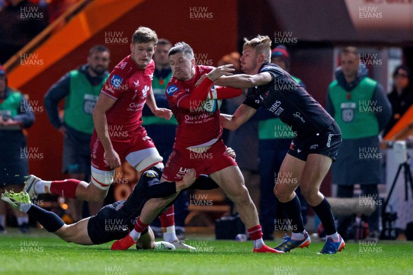 111123 - Scarlets v Emirates Lions - United Rugby Championship - Steff Evans of Scarlets is tackled by Richard Kriel of Lions