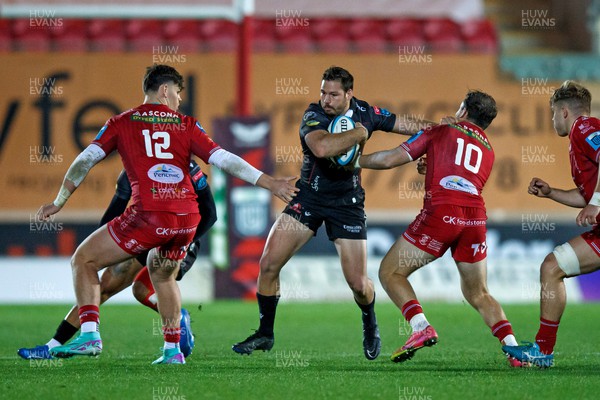 111123 - Scarlets v Emirates Lions - United Rugby Championship - Marius Louw of Lions hands off Ioan Lloyd of Scarlets