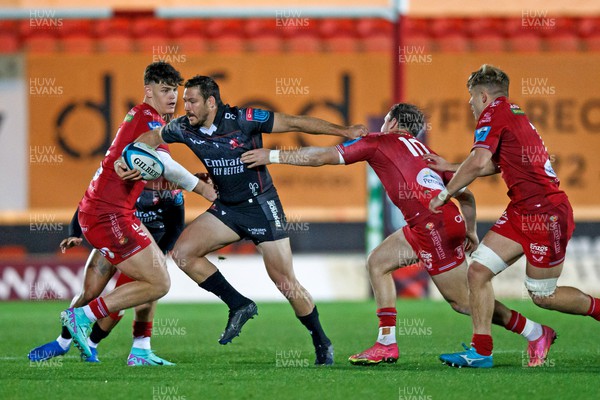 111123 - Scarlets v Emirates Lions - United Rugby Championship - Marius Louw of Lions hands off Ioan Lloyd of Scarlets