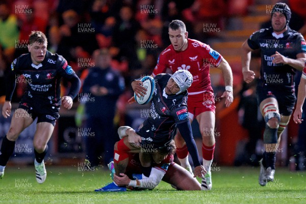 111123 - Scarlets v Emirates Lions - United Rugby Championship - Edwill van der Merwe of Lions is tackled