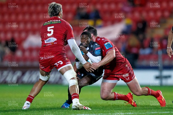 111123 - Scarlets v Emirates Lions - United Rugby Championship - Sanele Nohamba of Lions is tackled by Ryan Elias of Scarlets