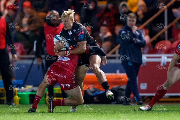 111123 - Scarlets v Emirates Lions - United Rugby Championship - JC Pretorius of Lions is tackled by Ioan Nicholas of Scarlets