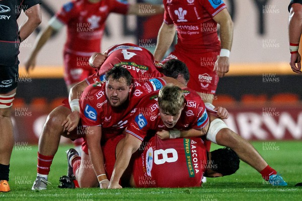 111123 - Scarlets v Emirates Lions - United Rugby Championship - Harri O’Connor and Teddy Leatherbarrow of Scarlets protect the ball at a ruck