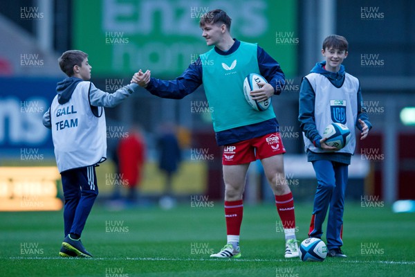 111123 - Scarlets v Emirates Lions - United Rugby Championship - Charlie Titcombe of Scarlets with ball boys before the match