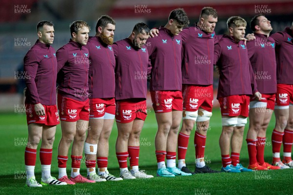 111123 - Scarlets v Emirates Lions - United Rugby Championship - Scarlets players observe a minute's silence to mark Remembrance Day