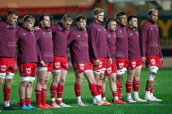 111123 - Scarlets v Emirates Lions - United Rugby Championship - Scarlets players observe a minute's silence to mark Remembrance Day