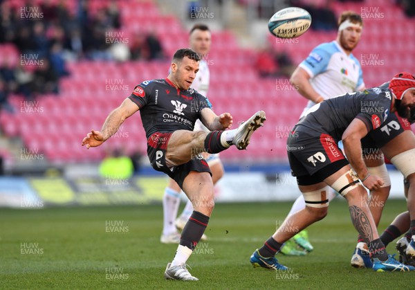 050322 - Scarlets v Glasgow - United Rugby Championship - Gareth Davies of Scarlets gets the ball away