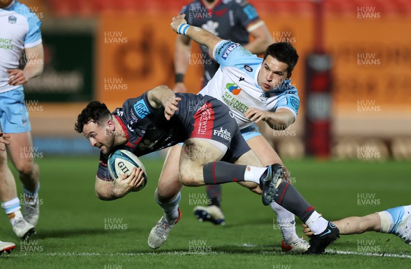 050322 - Scarlets v Glasgow - United Rugby Championship - Ryan Conbeer of Scarlets is tackled by Sam Johnson of Glasgow