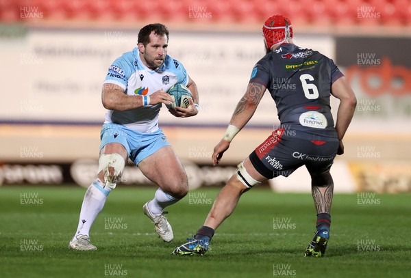 050322 - Scarlets v Glasgow - United Rugby Championship - Fraser Brown of Glasgow is challenged by Blade Thomson of Scarlets