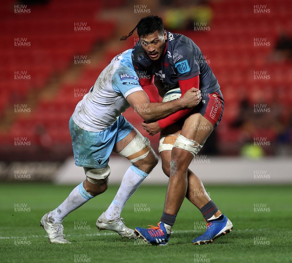 050322 - Scarlets v Glasgow - United Rugby Championship - Sam Lousi of Scarlets is tackled by Kiran McDonald of Glasgow