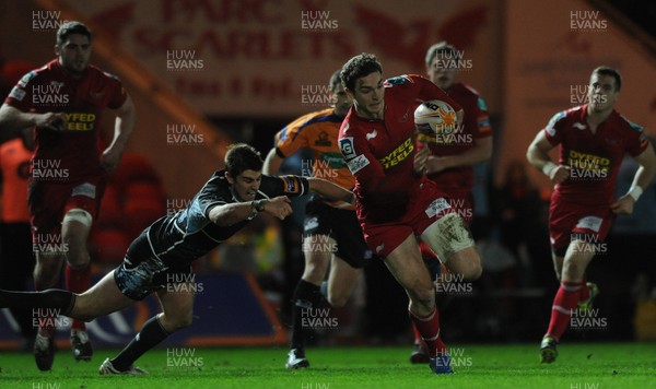 07.01.12 - Scarlets v Glasgow - RaboDirect PRO12 - George North of Scarlets gets past Peter Murchie of Glasgow. 