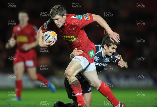 07.01.12 - Scarlets v Glasgow - RaboDirect PRO12 - Rhys Priestland of Scarlets is tackled by Peter Murchie of Glasgow. 