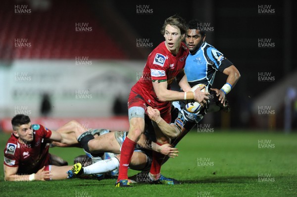 120413 - Scarlets v Glasgow Warriors - RaboDirect PRO12 -Liam Williams of Scarlets is tackled by Duncan Weir of Glasgow 