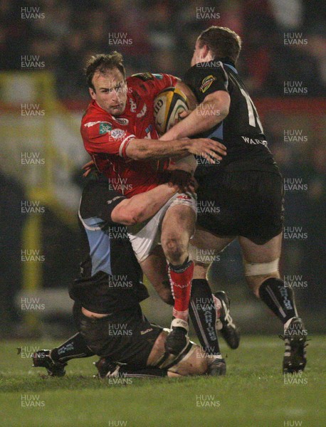 15.02.08..Llanelli Scarlets v Glasgow Warriors, Magners League -  Scarlets Gavin Cattle is brought down by Glasgows Calum Forrester and  James Eddie 