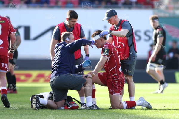 290423 - Scarlets v Glasgow Warriors - EPCR Challenge Cup Semi-Final -  Joe Roberts of Scarlets receives treatment